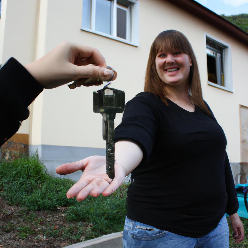 Woman handing keys to family