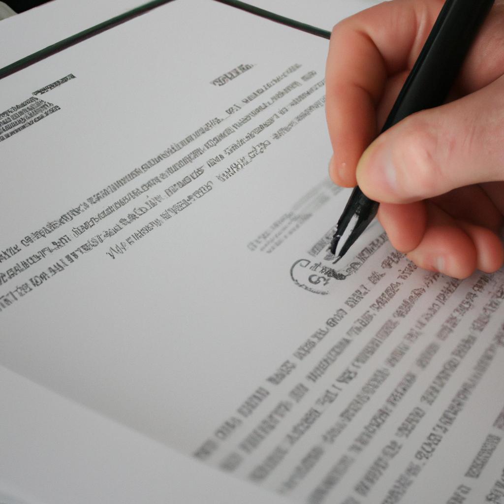 Person signing a legal document